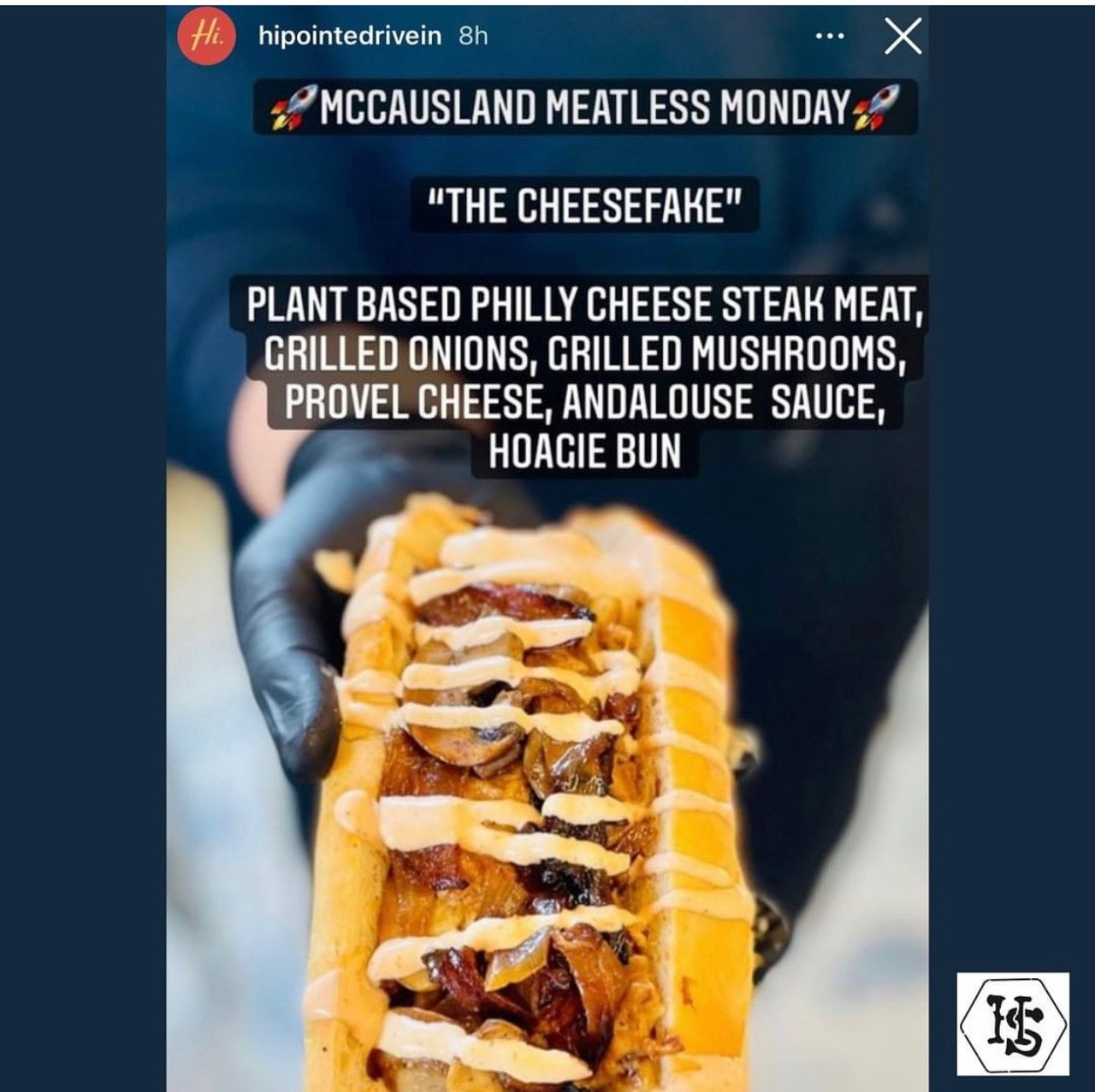 McCausland Meatless Monday: Instagram post from Hi Pointe Drive In showing a Philly Cheese Fake: Handheld long Hoagie bun filled with Harvest Shreds, grilled onions, mushrooms, Provel cheese, Andalouse sauce.