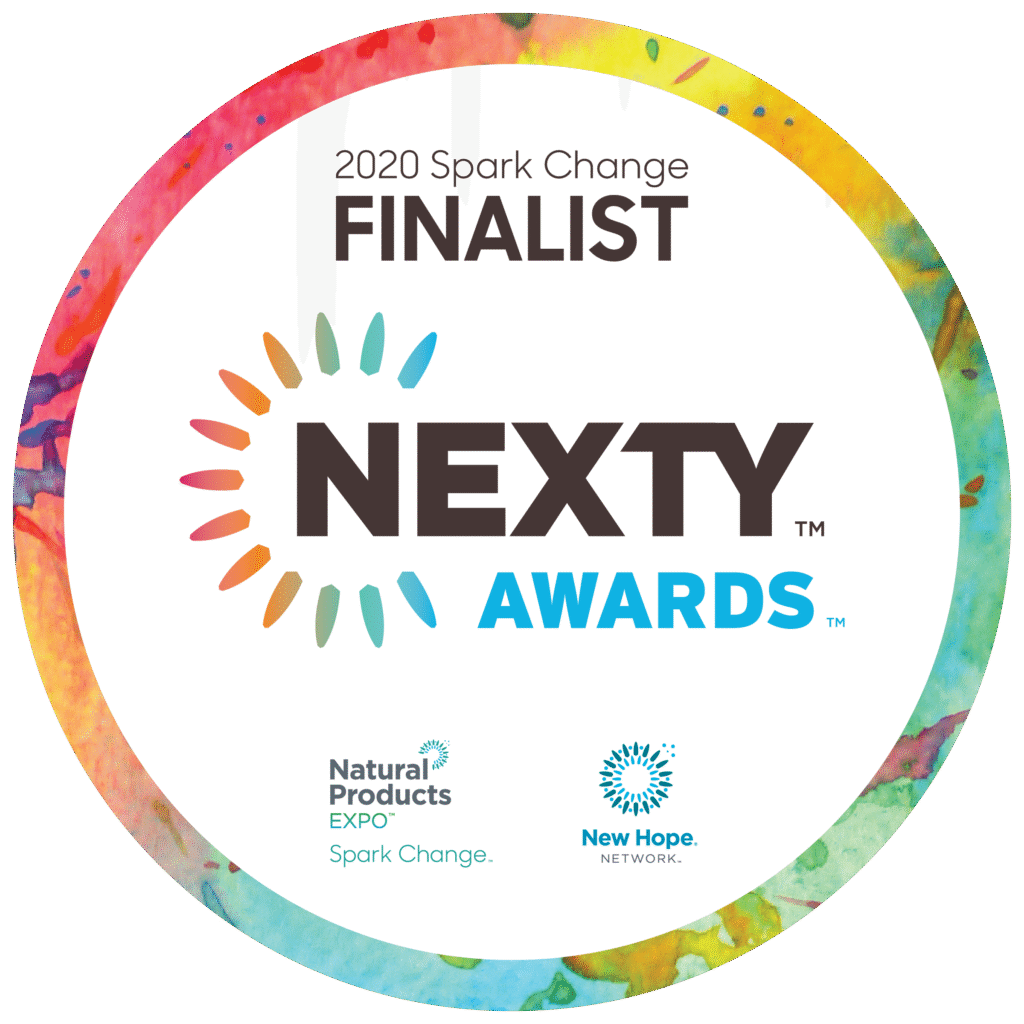 2020 Spark Change NEXTY Awards Finalist logo with a colorful circular border, the word 'NEXTY' in bold black letters surrounded by a sunburst of multicolored lines, and smaller logos for Natural Products Expo Spark Change and New Hope Network at the bottom.